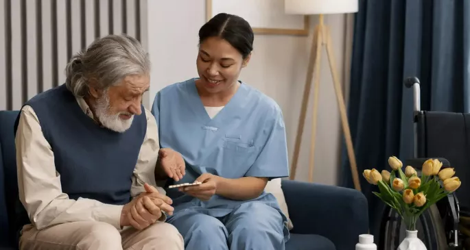 a nurse treating an old man with compassion in respite care home in sutton coldfield birminghan